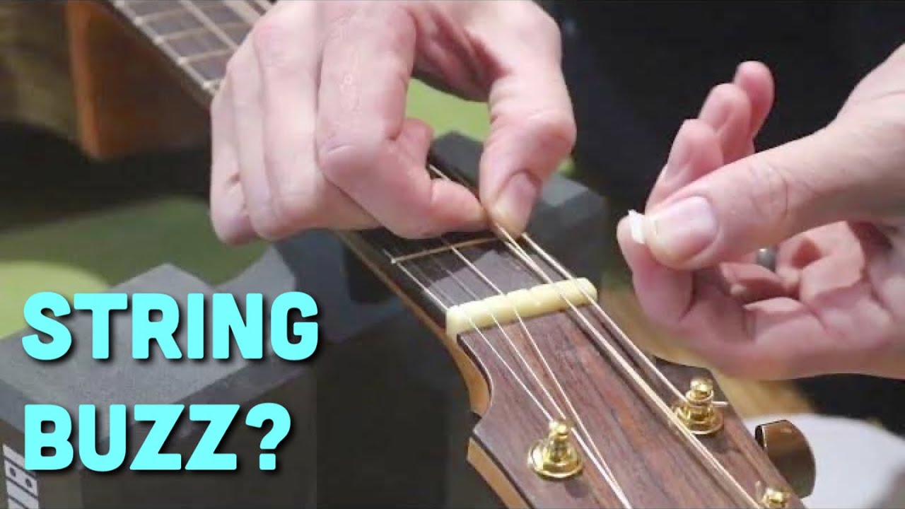 why do my guitar strings buzz?